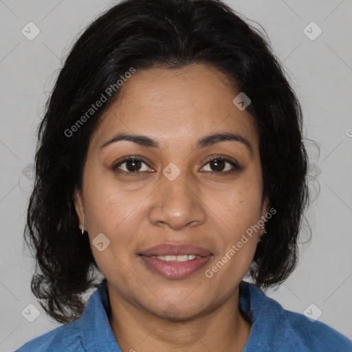 Joyful latino adult female with medium  brown hair and brown eyes