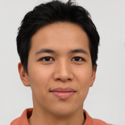 Joyful asian young-adult male with short  brown hair and brown eyes