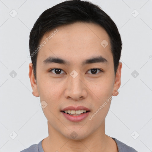 Joyful asian young-adult male with short  black hair and brown eyes