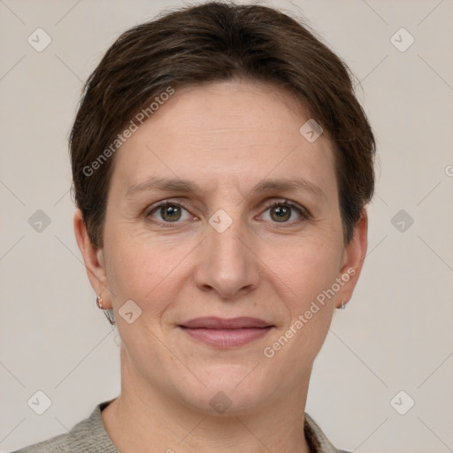 Joyful white adult female with short  brown hair and grey eyes