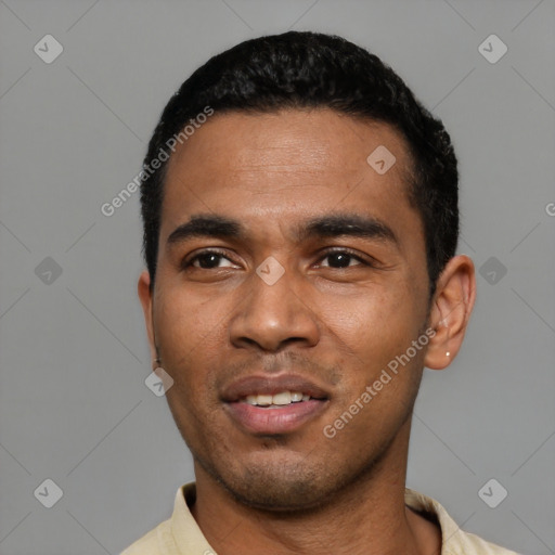 Joyful latino young-adult male with short  black hair and brown eyes