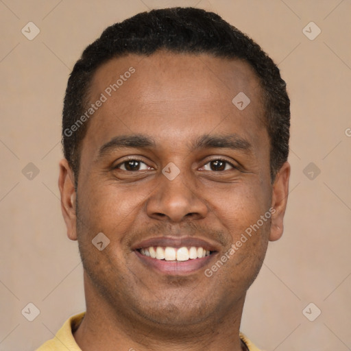 Joyful latino young-adult male with short  brown hair and brown eyes