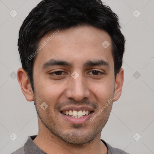 Joyful white young-adult male with short  black hair and brown eyes