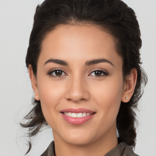 Joyful white young-adult female with long  brown hair and brown eyes