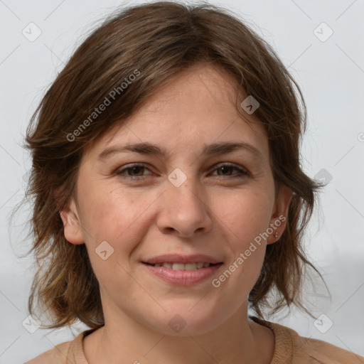 Joyful white adult female with medium  brown hair and brown eyes