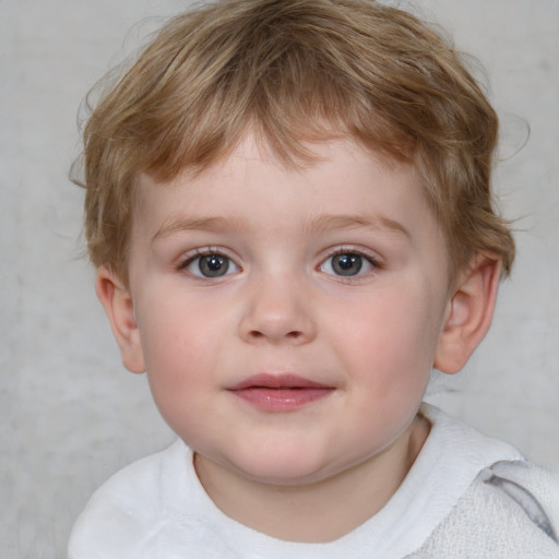 Joyful white child male with short  brown hair and blue eyes