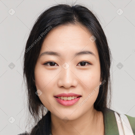 Joyful asian young-adult female with medium  black hair and brown eyes