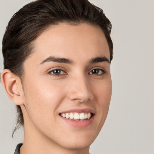 Joyful white young-adult female with short  brown hair and brown eyes