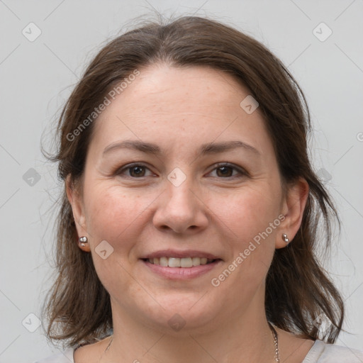 Joyful white young-adult female with medium  brown hair and grey eyes