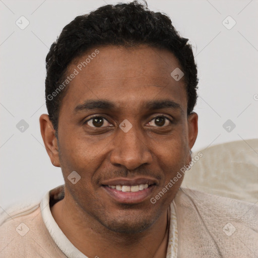 Joyful black young-adult male with short  brown hair and brown eyes