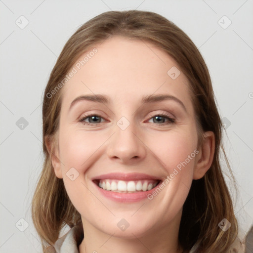 Joyful white young-adult female with long  brown hair and grey eyes