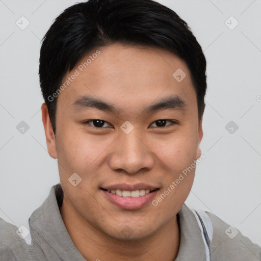 Joyful asian young-adult male with short  brown hair and brown eyes
