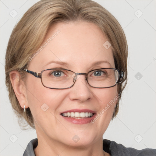 Joyful white adult female with medium  brown hair and blue eyes