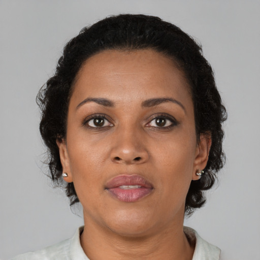 Neutral black adult female with short  brown hair and brown eyes