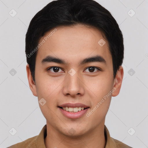 Joyful asian young-adult male with short  brown hair and brown eyes