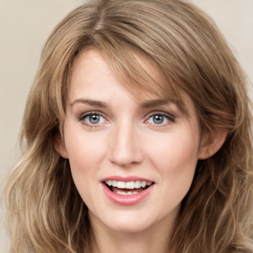 Joyful white young-adult female with long  brown hair and grey eyes