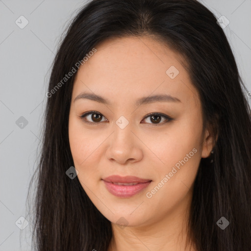 Joyful asian young-adult female with long  brown hair and brown eyes