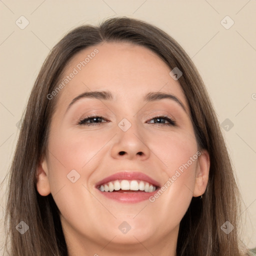 Joyful white young-adult female with long  brown hair and brown eyes