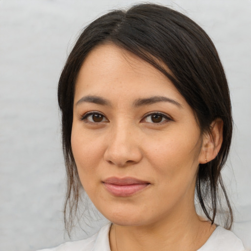 Joyful asian young-adult female with medium  brown hair and brown eyes