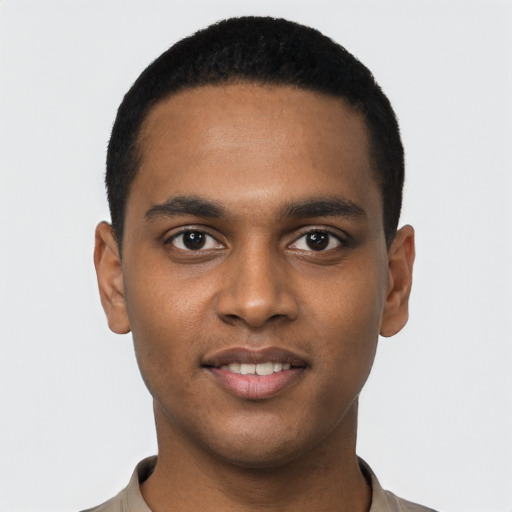 Joyful black young-adult male with short  black hair and brown eyes
