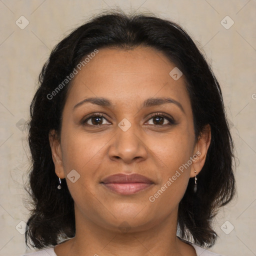 Joyful black adult female with medium  brown hair and brown eyes