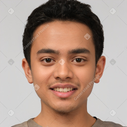 Joyful latino young-adult male with short  black hair and brown eyes