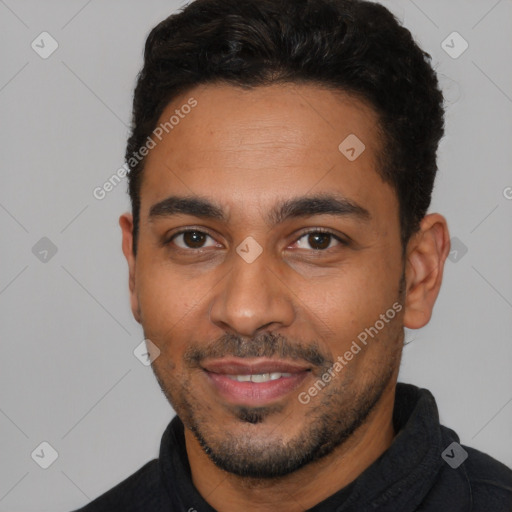 Joyful latino young-adult male with short  black hair and brown eyes