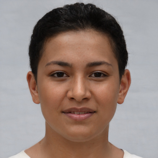 Joyful latino young-adult female with short  brown hair and brown eyes