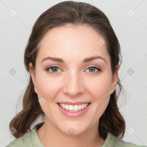 Joyful white young-adult female with medium  brown hair and green eyes