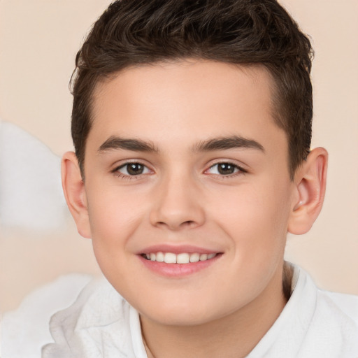 Joyful white child male with short  brown hair and brown eyes