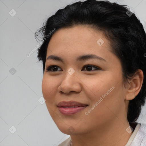 Joyful asian young-adult female with medium  black hair and brown eyes