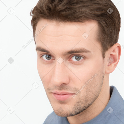 Neutral white young-adult male with short  brown hair and brown eyes