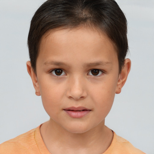 Joyful white child female with short  brown hair and brown eyes