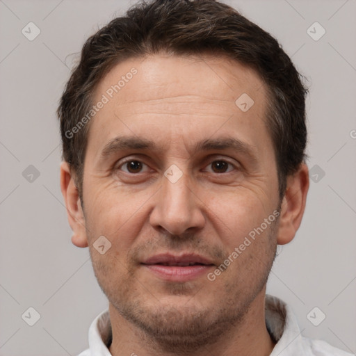 Joyful white adult male with short  brown hair and brown eyes