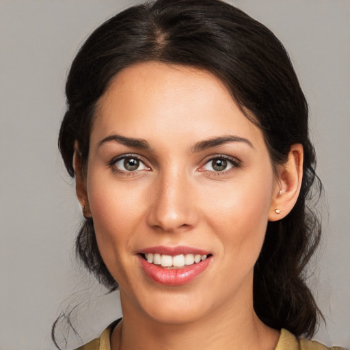 Joyful white young-adult female with medium  brown hair and brown eyes