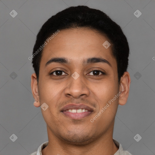 Joyful latino young-adult male with short  brown hair and brown eyes