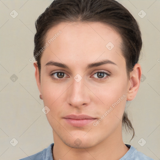 Neutral white young-adult female with short  brown hair and brown eyes