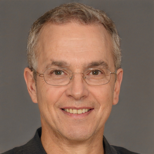 Joyful white middle-aged male with short  gray hair and brown eyes