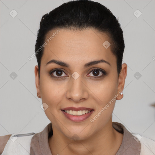 Joyful latino young-adult female with short  black hair and brown eyes