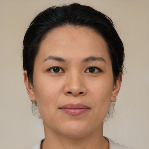 Joyful asian young-adult female with medium  brown hair and brown eyes