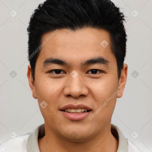 Joyful asian young-adult male with short  black hair and brown eyes