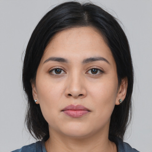 Neutral latino young-adult female with medium  black hair and brown eyes