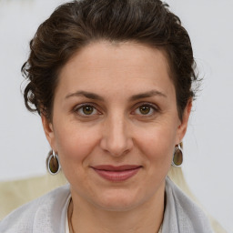 Joyful white adult female with short  brown hair and brown eyes