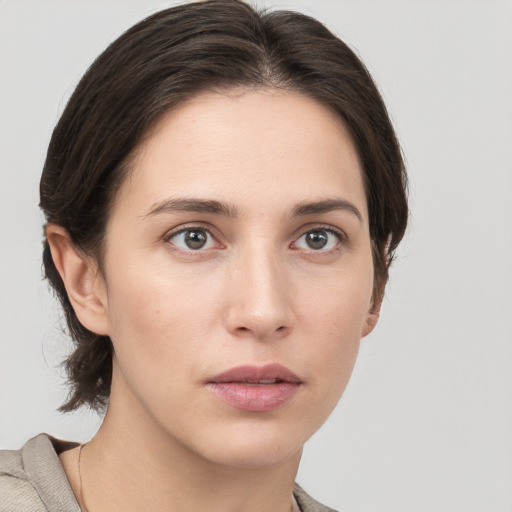 Neutral white young-adult female with medium  brown hair and brown eyes