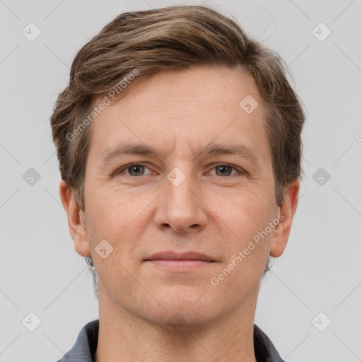 Joyful white adult male with short  brown hair and grey eyes