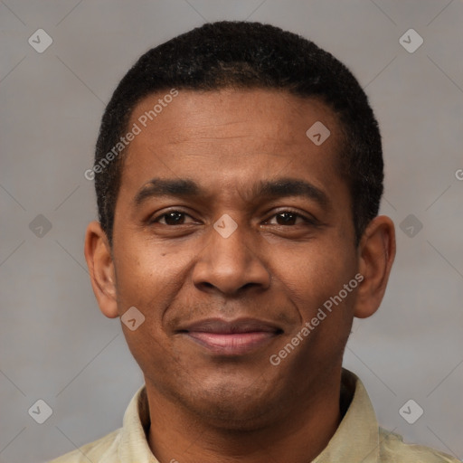 Joyful latino young-adult male with short  brown hair and brown eyes