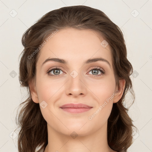 Joyful white young-adult female with medium  brown hair and green eyes