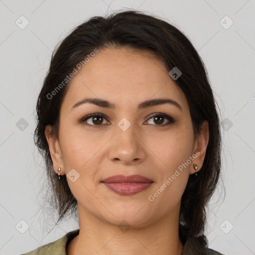 Joyful latino young-adult female with medium  brown hair and brown eyes