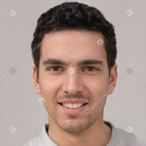 Joyful white young-adult male with short  black hair and brown eyes