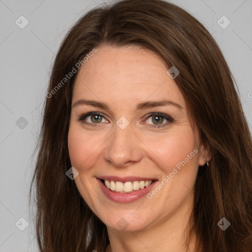 Joyful white adult female with long  brown hair and brown eyes